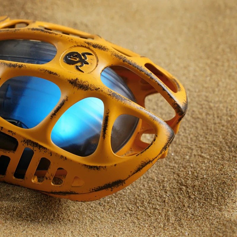 Close-up of GravaStar Mercury X Pro 8K Battle Worn Yellow mouse shell with blue lighting