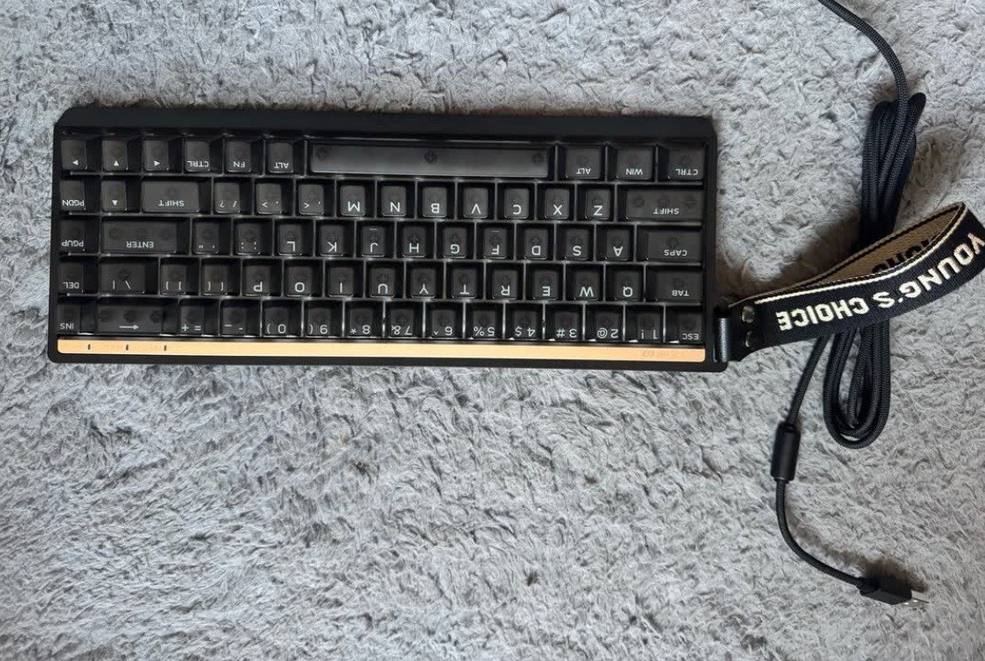 MCHOSE Ace68 V2 keyboard top front view with gold accent strip and Young's Choice strap