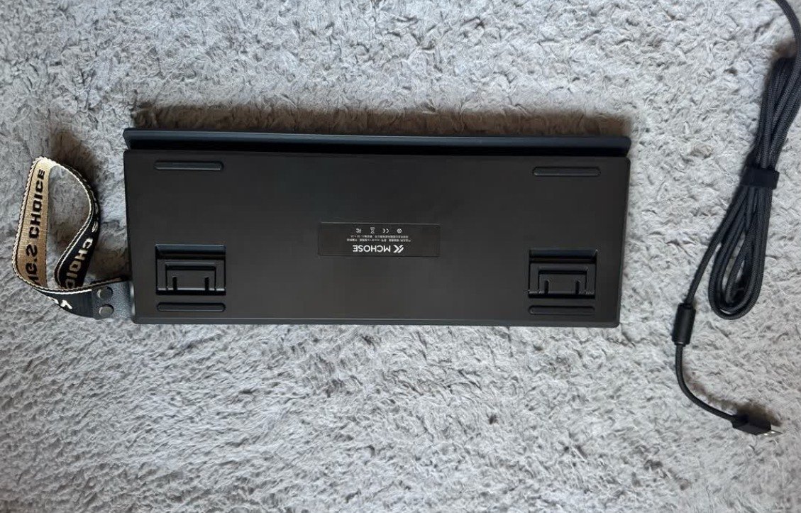 MCHOSE Ace68 V2 keyboard underside view with adjustable feet and product label